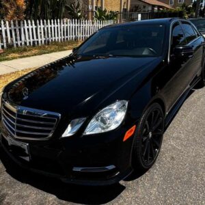 a black car parked on a road