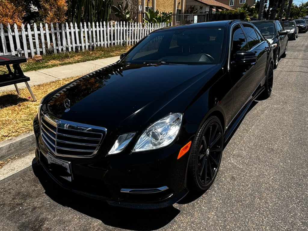 a black car parked on a road