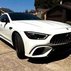 a white car parked in a driveway