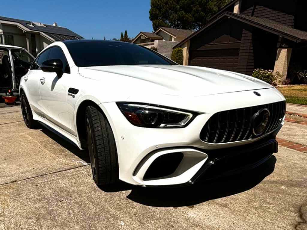 a white car parked in a driveway